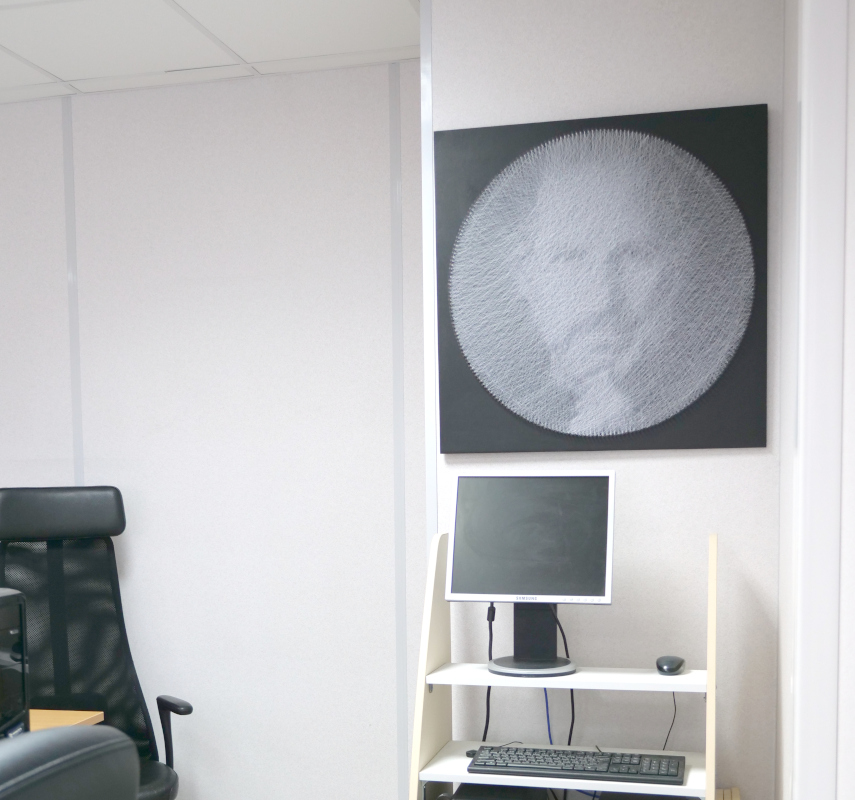 Steve Jobs portrait string-art picture in real office interior